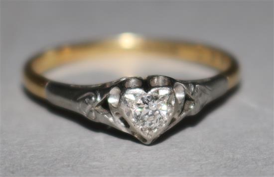 An 18ct gold and platinum and solitaire diamond ring in heart shaped mount, size Q.